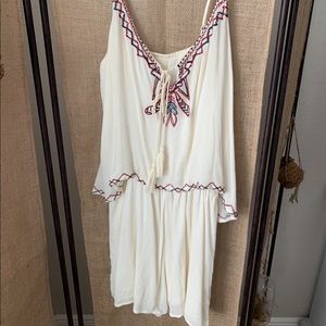 White romper with red and blue details